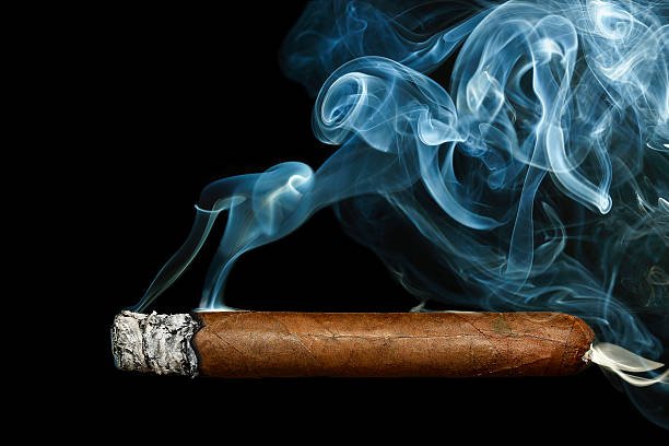 cigar with smoke on black background